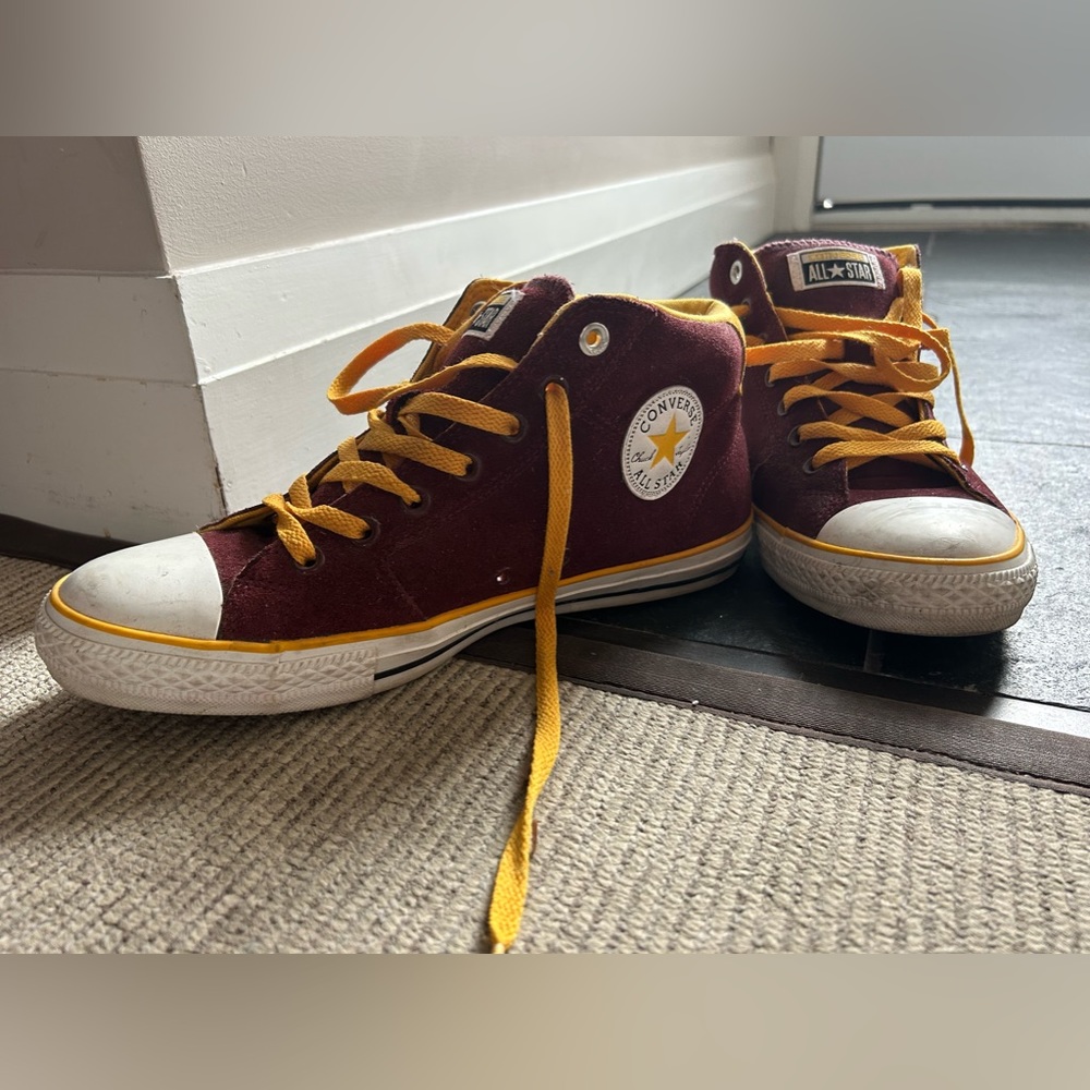 Maroon and yellow suede converse high tops